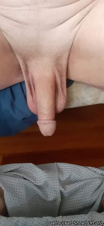 weight of soft cock and balls pulling skin down