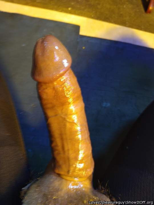 Hard cock lubed up.  Very sexy.    
