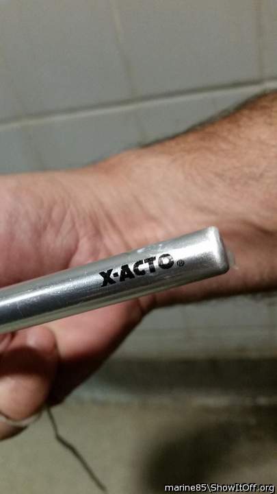 Stretching urethra with X-acto knife handle