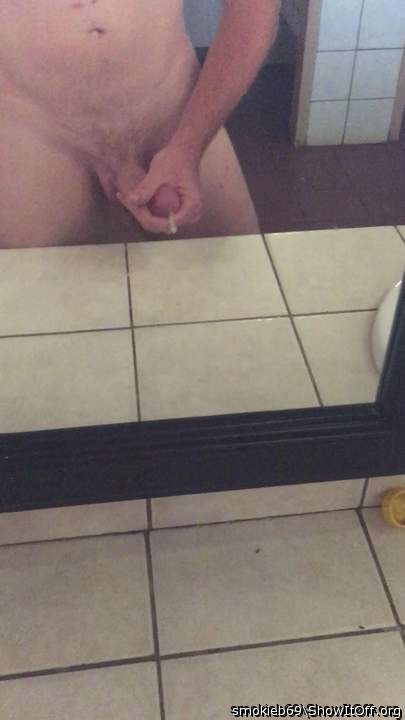 cumming in full view in public bathroom