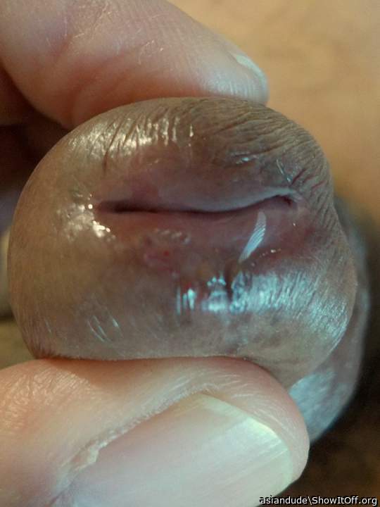 Squeezing my precum out..
