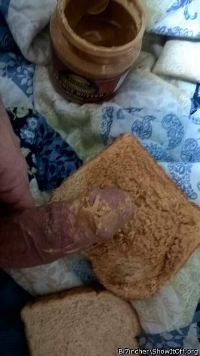 spreading peanut butter on bread with my erect cock
