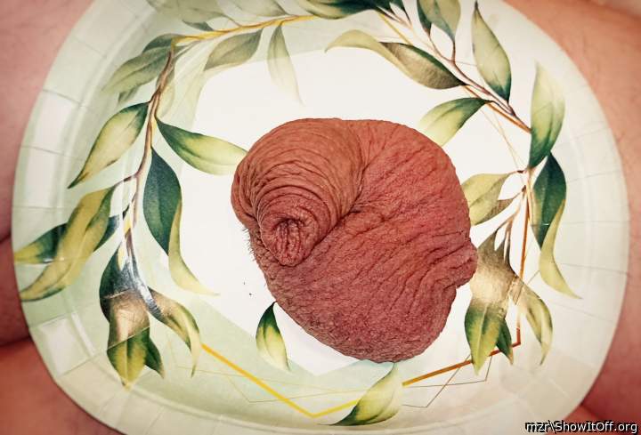 A plate with a dish of testicles and foreskin