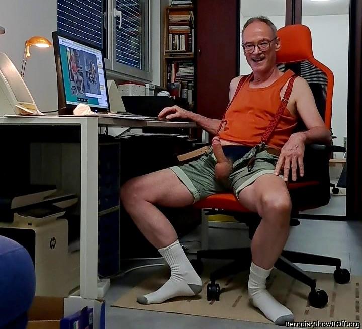 smiling face, openened short trousers, erected Penis