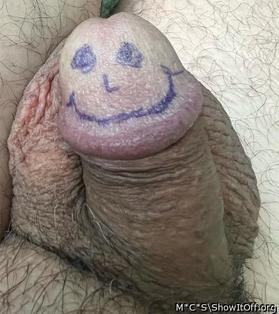 No need to draw a face. A circumcised penis is always smilin