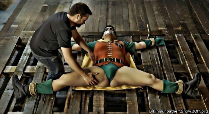 Robin tied up spread eagle