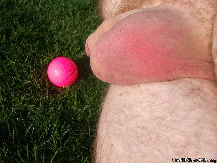 A golf ball with my balls out in the sun.