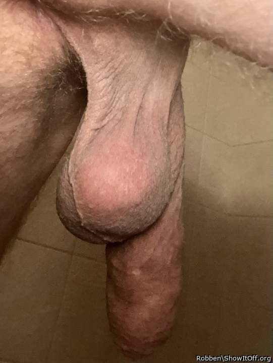 Soft penis hang seen from behind