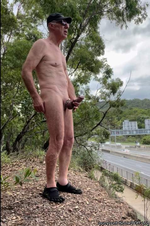 Rob Venuta poses beside a busy road 3