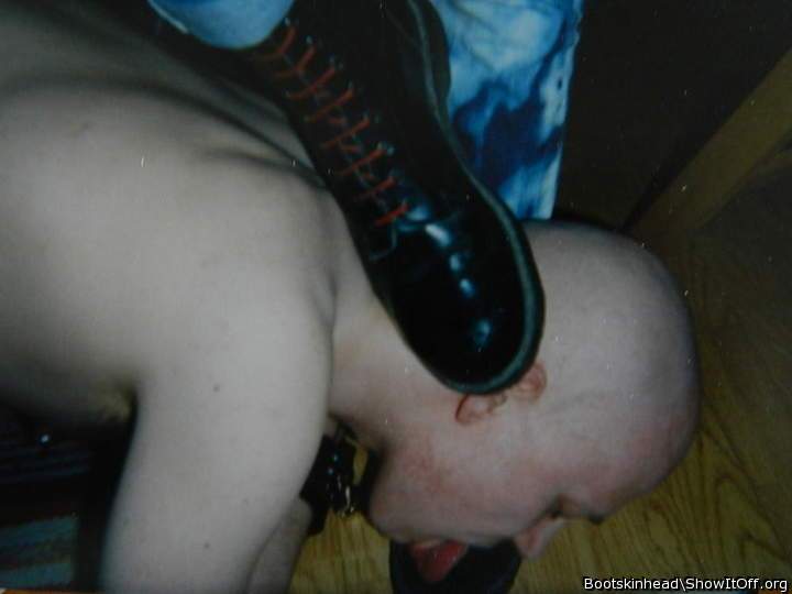 Skinhead slave licking masters boots