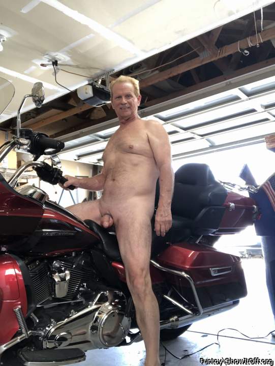 Nude on my motorcycle with garage door open.