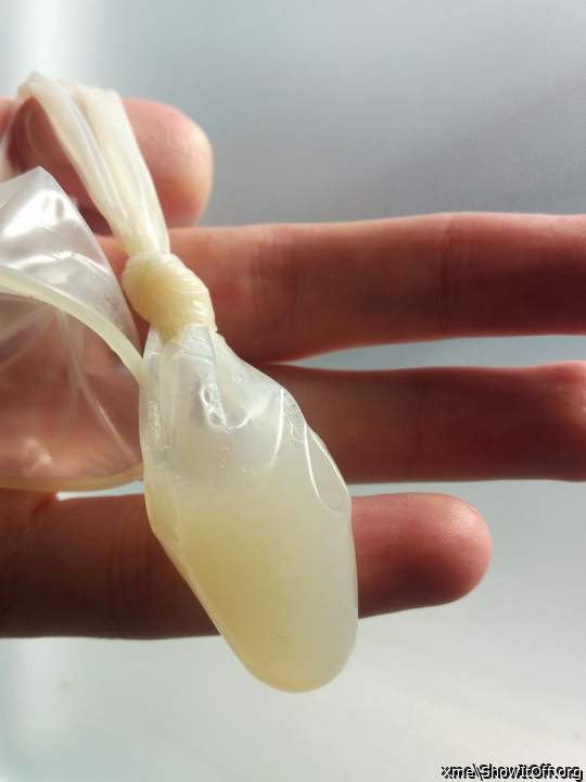 and here is the result : after a good fuck, cum filled condom inside her pussy