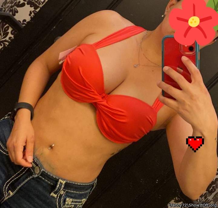 Trying on bikini top at the store