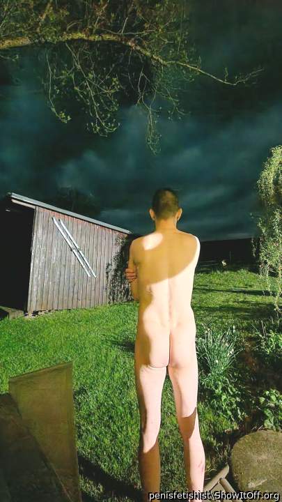my bare ass at night in front of the hot tub at a cabin in the mountains