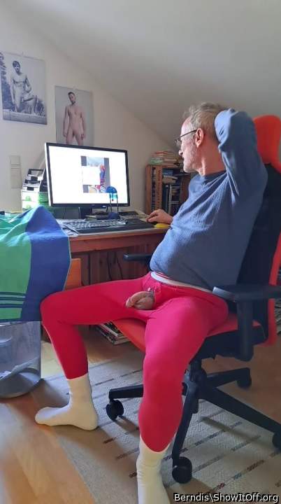 soft Penis laying on the balls out of red long johns underwear