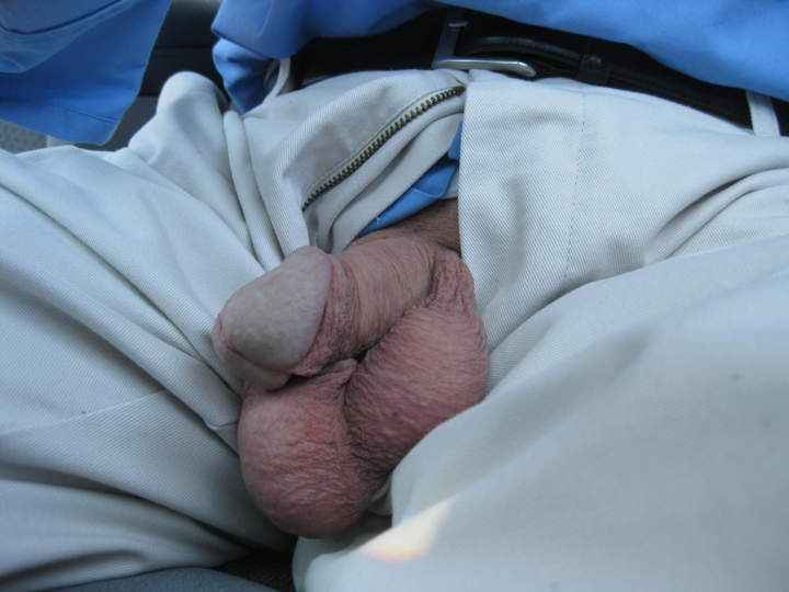 Sitting in car with floppy cock and balls hanging out....