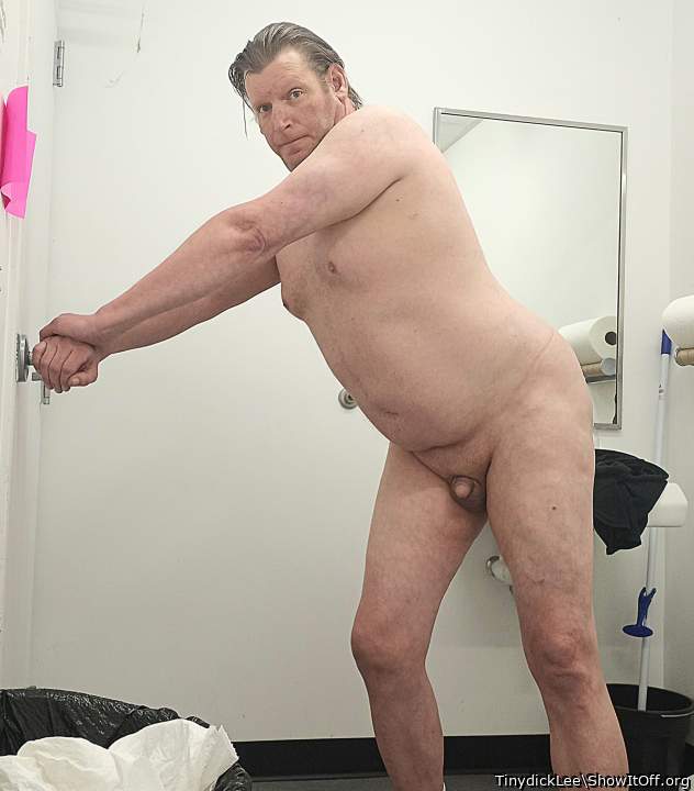 Naked in a public bathroom