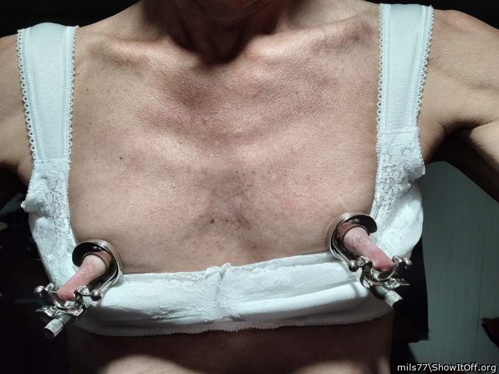 Magnificent nipple stretching, perfect for licking.      