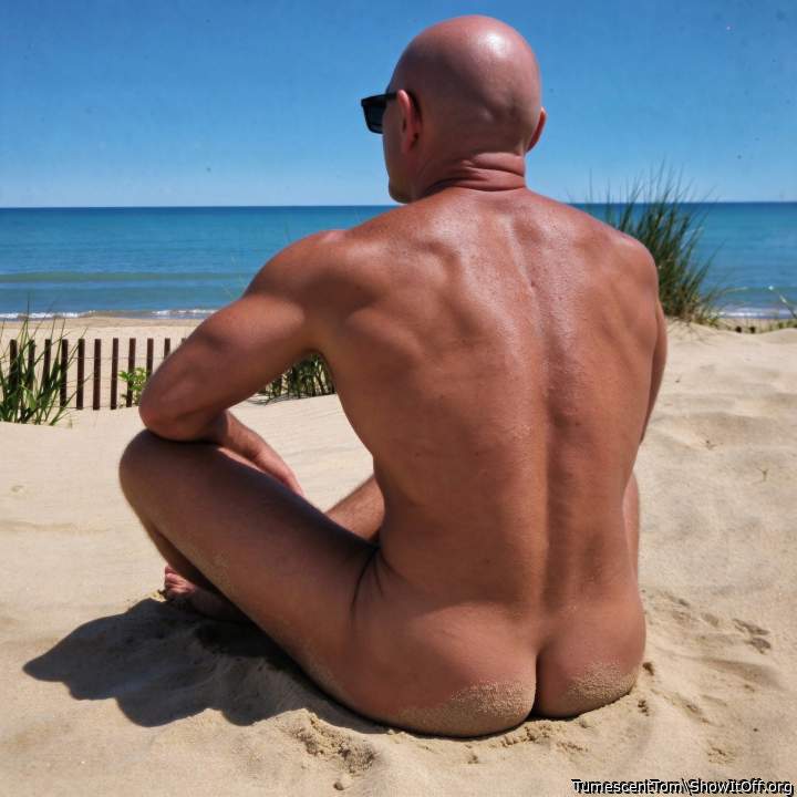 Bare-assed on the beach.