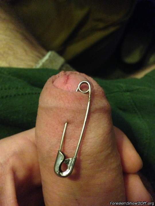 Safety pin through foreskin