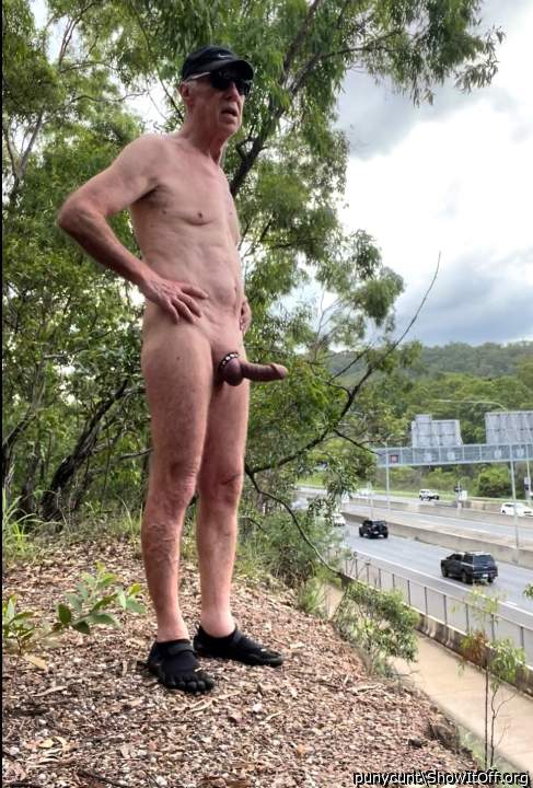 Rob Venuta poses beside a busy road 1