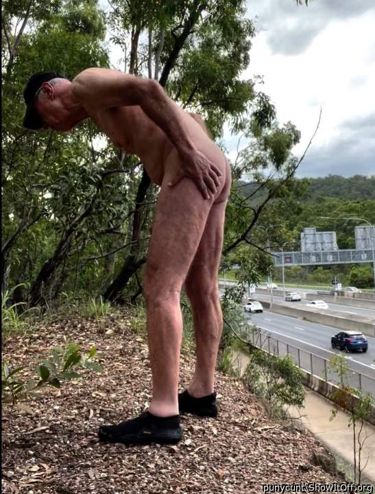 Rob Venuta poses beside a busy road 2