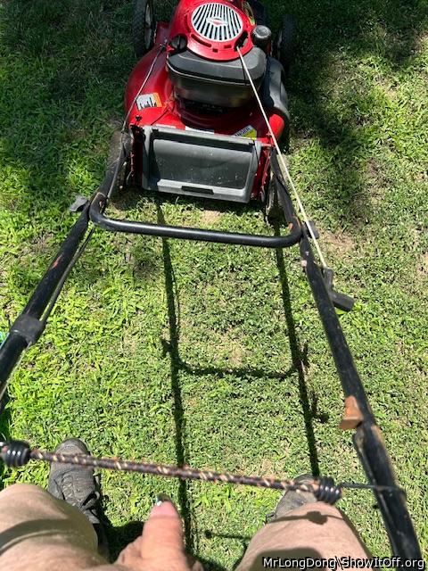 Staying cool while mowing the grass.