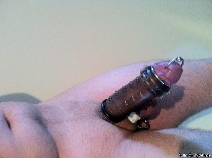 pierced cock in cock sheath with my balls wrapped up