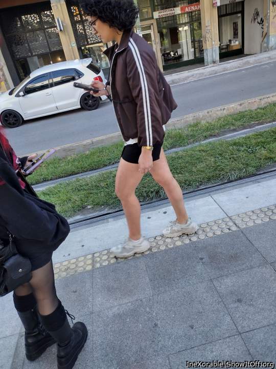 2 random chicks with hot legs on tram station